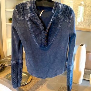 Free people 100 percent cotten top with hook/ eye button closure.